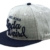 Nebelkind Snapback Cap grau mit blauem Schirm und Pillenmuster onesize unisex - 